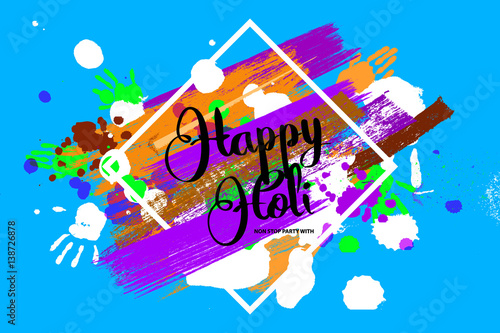 Happy holi on a background of hand prints.
