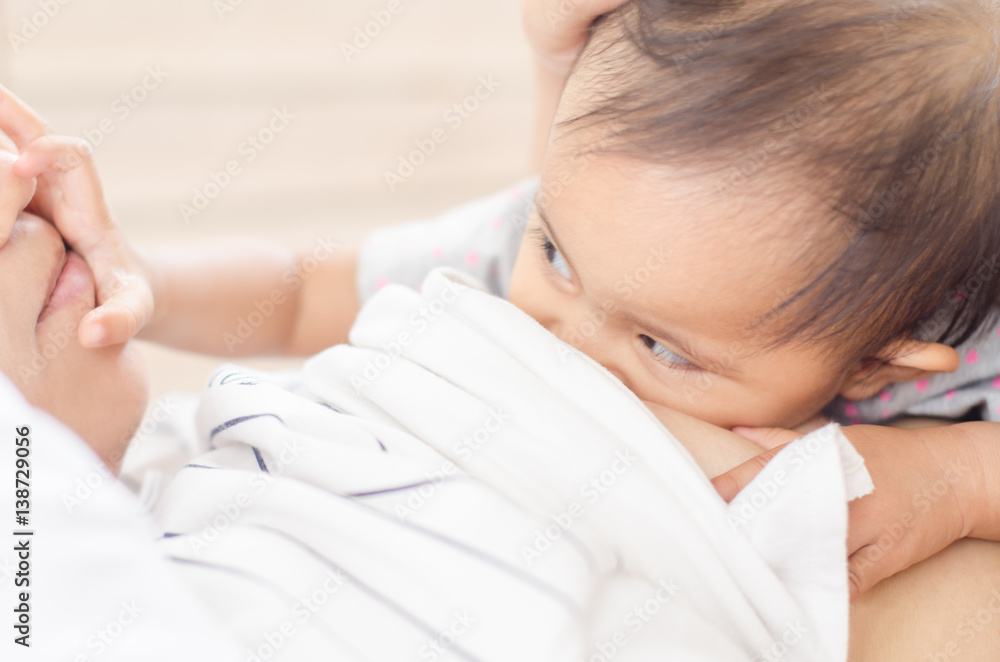 Mother breastfeeding her baby . Milk from mother's breast is a natural medicine to baby. Mother breastfeeding her baby . Milk from mother's breast is a natural medicine to baby.