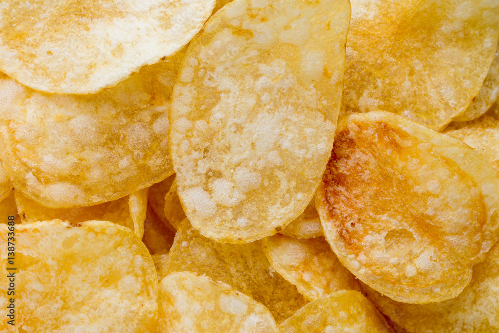 Close up potato chips on wood top view background. Close up potato chips on wood top view background.