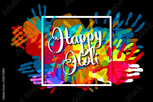 Happy holi on a background of hand prints