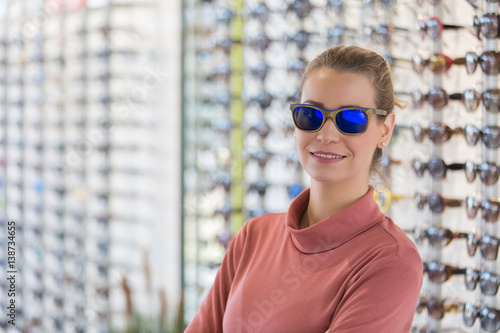 woman wearing sunglasses in optician shop