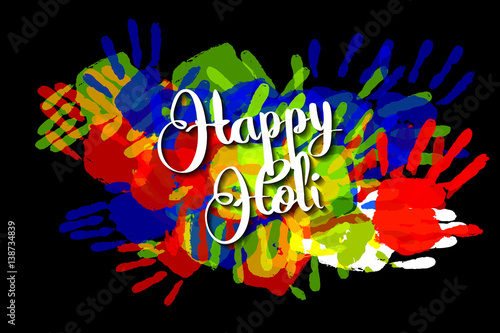 Happy holi on a background of hand prints
