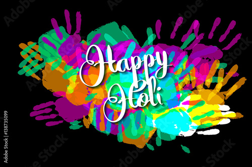 Happy holi on a background of hand prints
