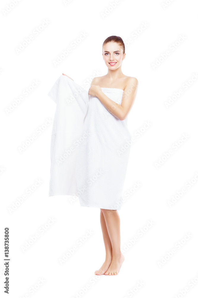 Young, beautiful and natural woman wrapped in towel isolated on white. Young, beautiful and natural woman wrapped in towel isolated on white.