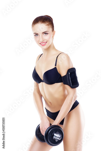 Fit, healthy and sporty woman in black swimsuit isolated on white. Beautiful girl with dumbbell. Sport, fitness, diet, weight loss and healthcare concept.