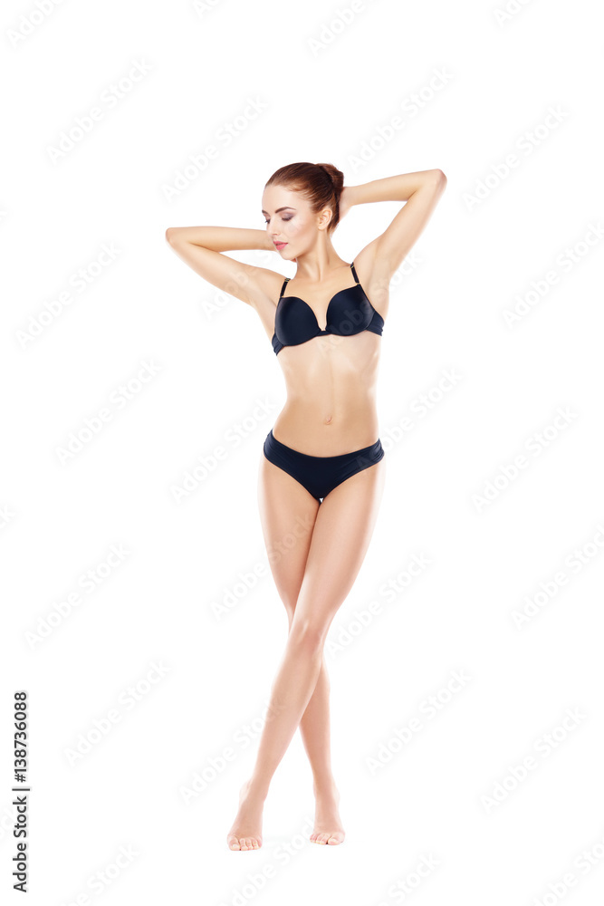 Fit, healthy and sporty woman in black underwear isolated on white. Sport, fitness, diet, weight loss and healthcare concept.