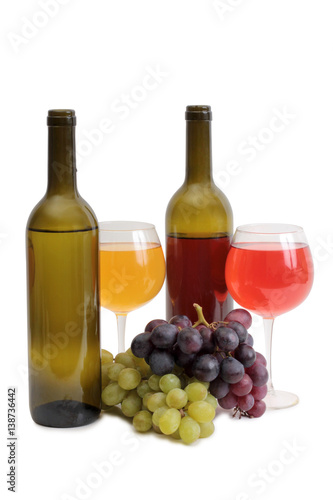 Bottle glass of wine and grapes on white background