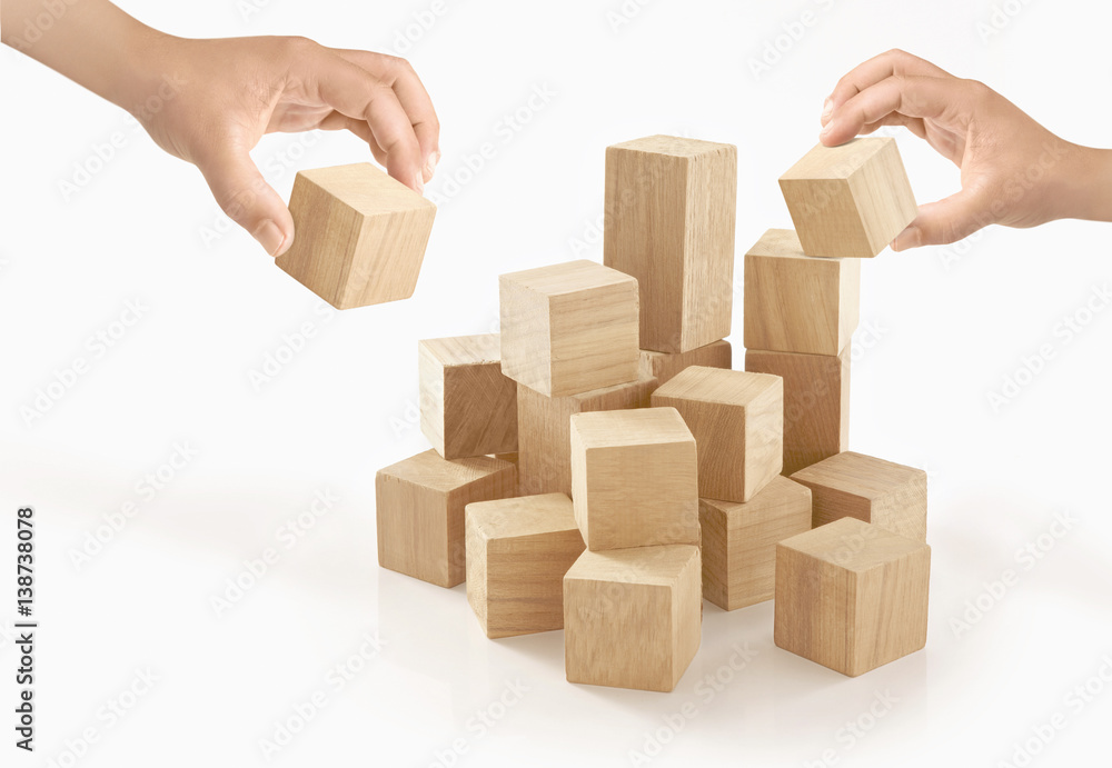 Two hands playing wooden box on isolated background. Two hands playing wooden box on isolated background.