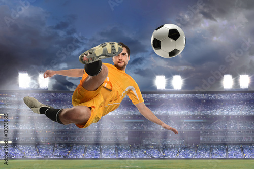 Soccer Player Kicking Ball in Midair