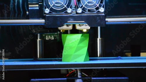 Closeup 3D printer builds up the object with hot molten plastic. The progressive modern additive technology 3D printing. The 4ht industrial revolution. photo