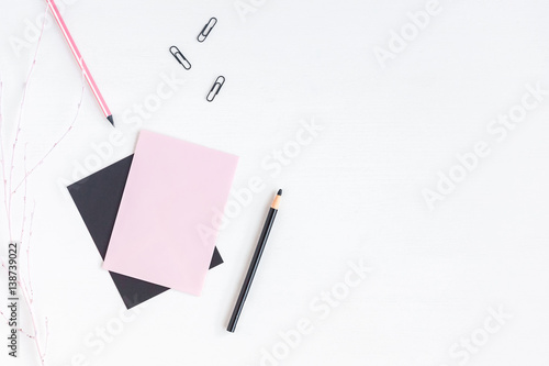 Feminine workspace with paper blank, pencils. Business concept. Flat lay, top view