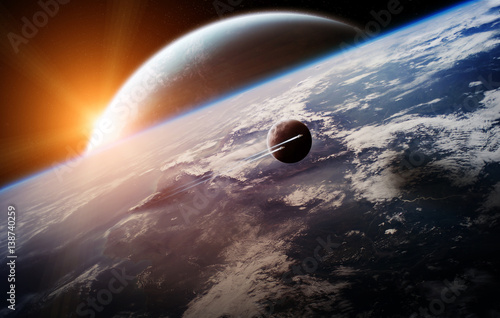 Fototapeta Naklejka Na Ścianę i Meble -  Sunrise over distant planet system in space 3D rendering elements of this image furnished by NASA