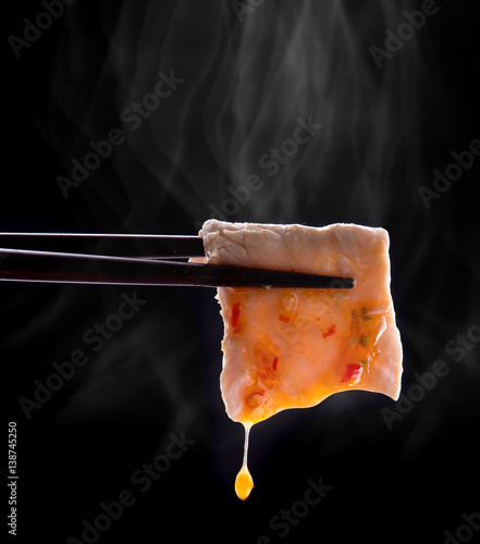 Obraz na plátně Sukiyaki or Shabu shabu pork slice with sauce in chopsticks and smoke