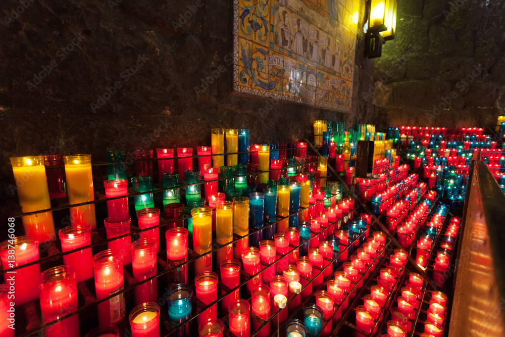 Blurred abstract background with candle lights bokeh in a Montserrat monastery, Catalonia, Spain