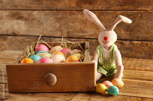 Drawer with colorful eggs a...