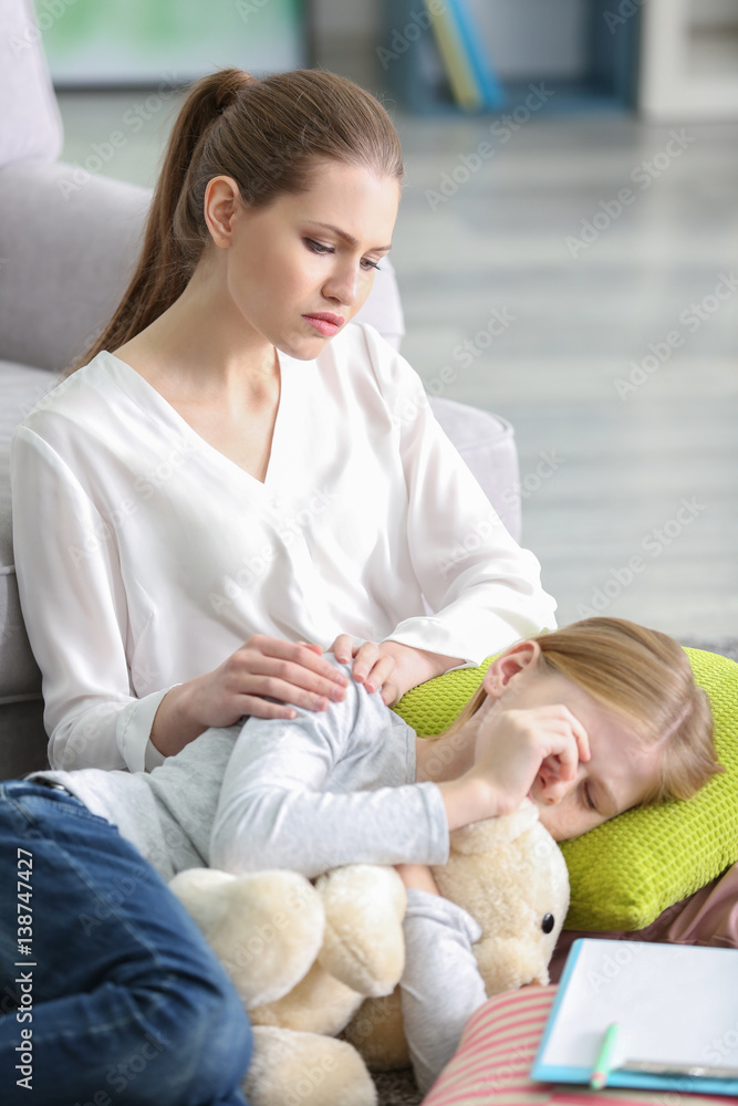 Young female psychologist working with teenager girl in office Young female psychologist working with teenager girl in office