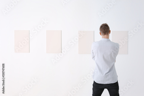Young man at art gallery