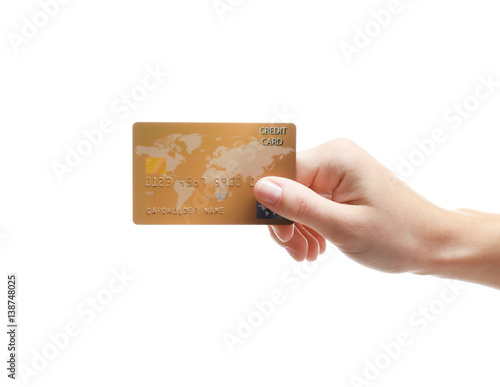 Hand holding credit card is...