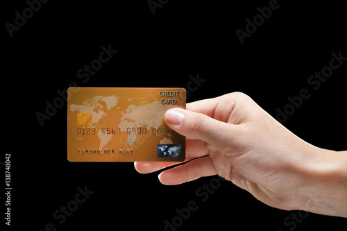 Hand holding credit card on...