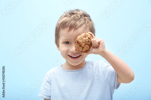 Cute little boy holding coo...