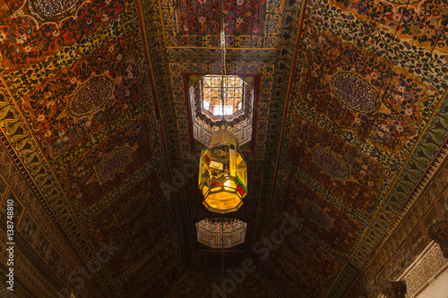 Colorful oriental Ceiling fragment inside the Bahia palace