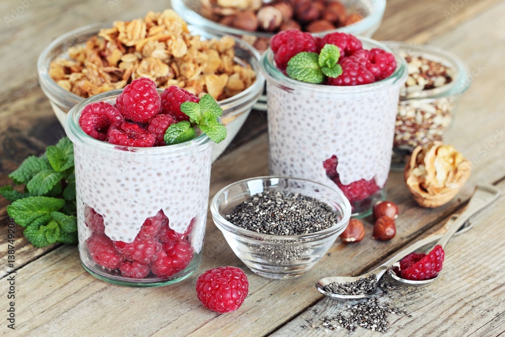 Chia seeds pudding with fresh raspberries.Detox breakfast . Super foods concept. Chia seeds pudding with fresh raspberries.Detox breakfast . Super foods concept.