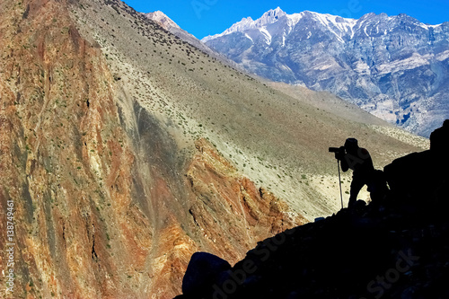 Man photographing mountains in Nepal. Kingdom of Mustang. Himalayas.