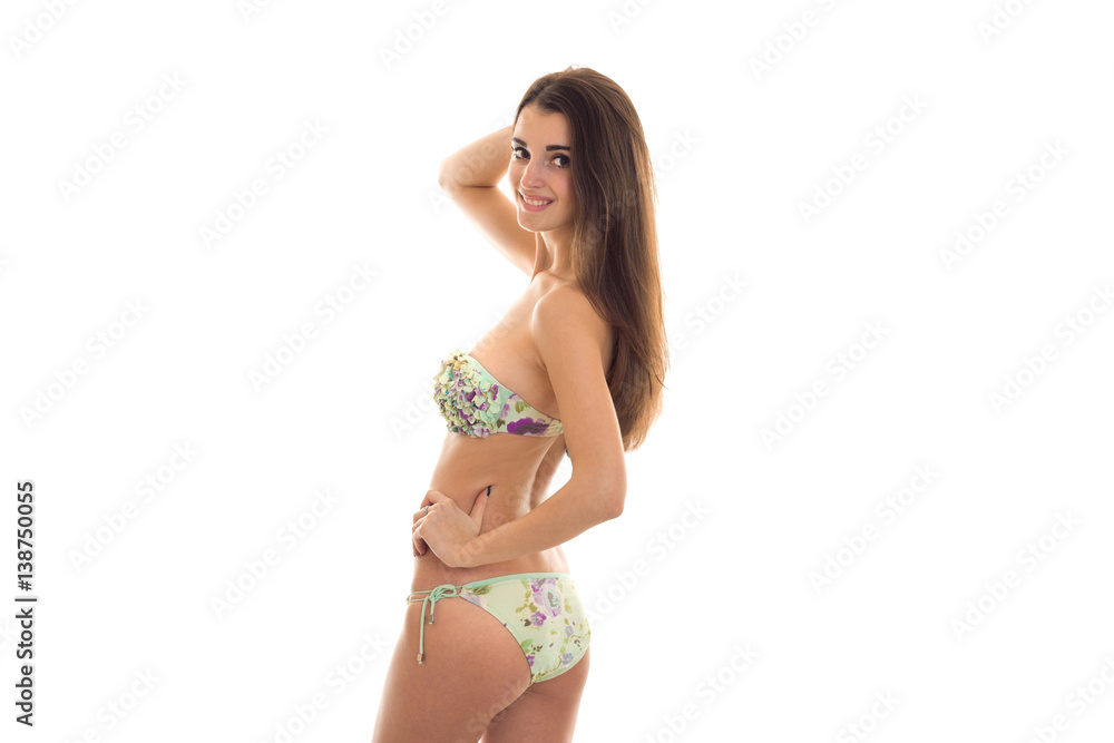girl with nice sexy body in swimsuit worth turning sideways to the camera isolated on white background girl with nice sexy body in swimsuit worth turning sideways to the camera isolated on white background
