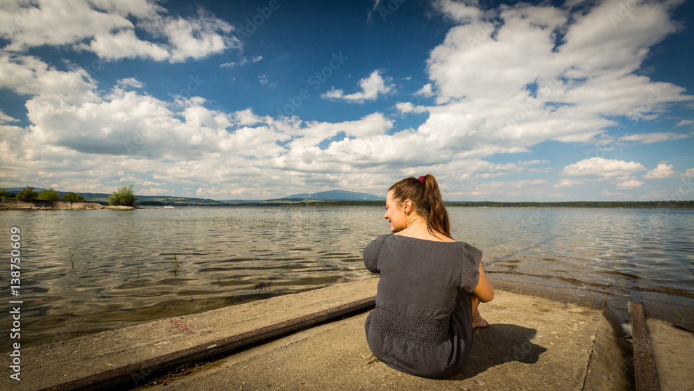 Girl at the barrier lake Oravska Priehrada in northern Slovakia