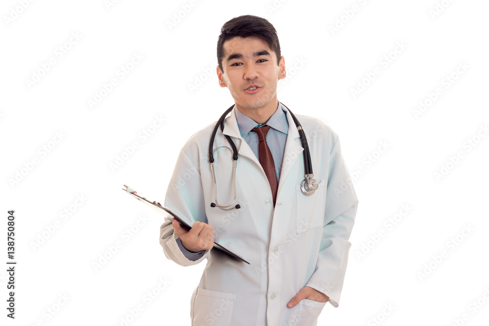 funny male doctor in uniform with stethoscope on his neck posing on camera isolated on white background funny male doctor in uniform with stethoscope on his neck posing on camera isolated on white background