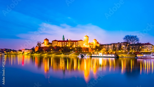 Royal castle of the Polish kings on the Wawel hill, over the Vistula river in the evening, Krakow, Poland