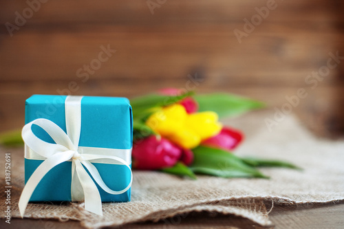 Spring tulips and gift. Greeting. Concept of holiday  birthday  Easter  March 8.