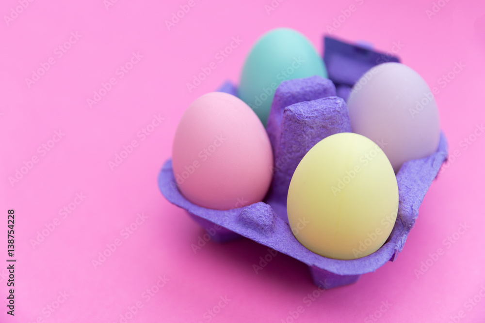 Easter eggs box on pink background