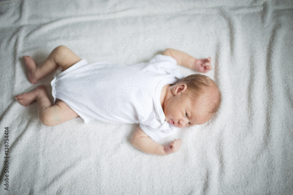 cute newborn baby sleeping on the bed cute newborn baby sleeping on the bed