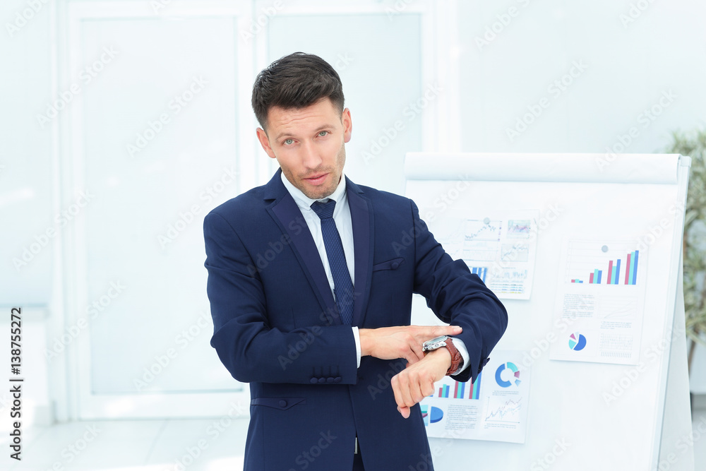 concept - take care of your time. businessman points to his watc concept - take care of your time. businessman points to his watc