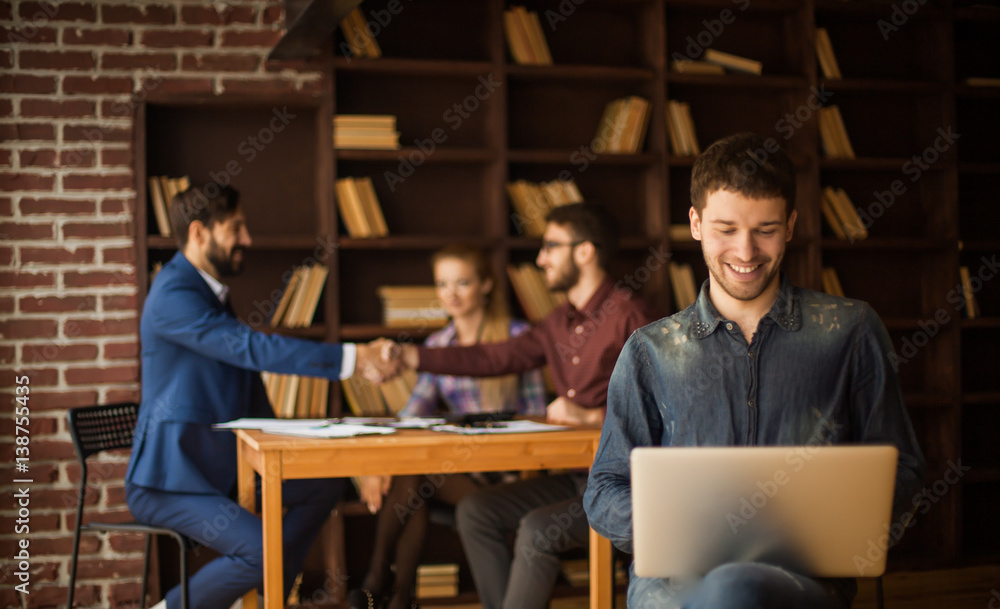 sales Manager with notebook on background of business partners h sales Manager with notebook on background of business partners h