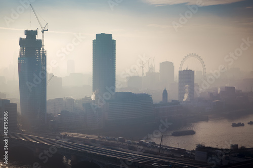 rooftop view over London on a foggy day from St Paul's cathedral, UK