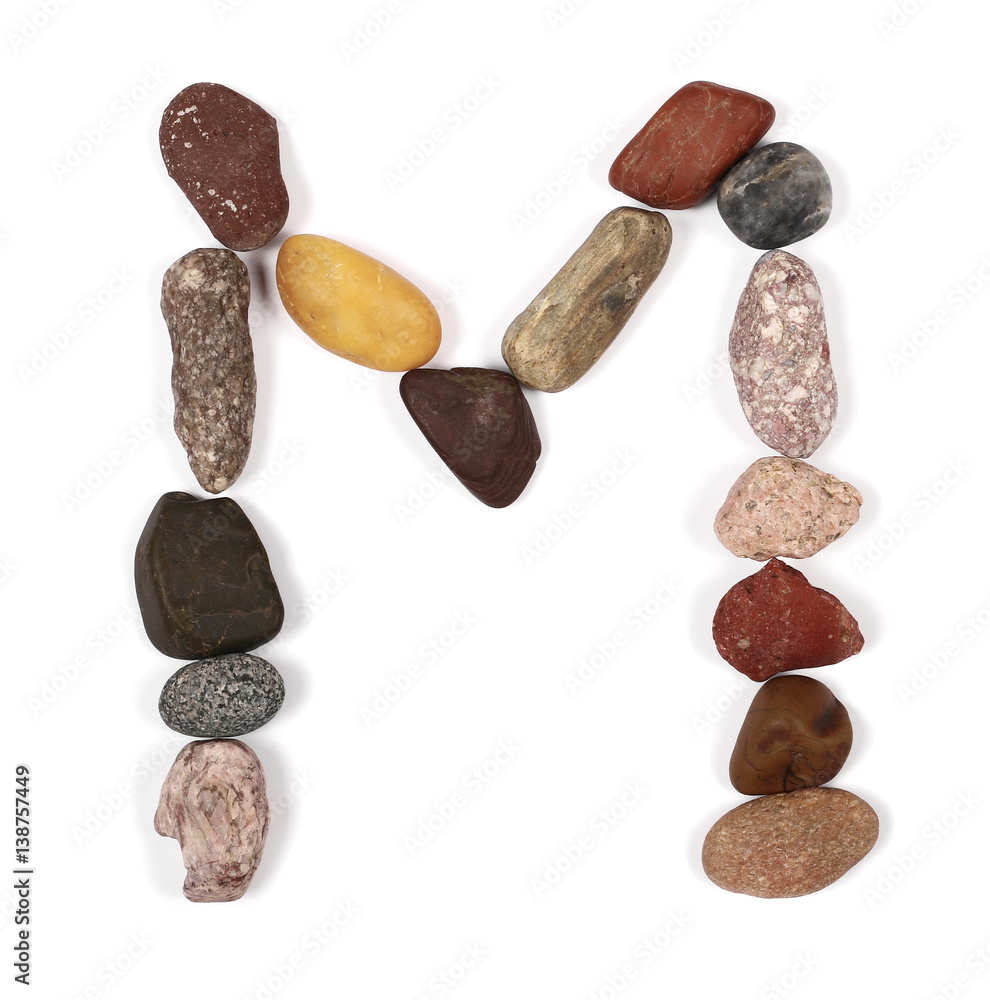 Fototapeta premium letter m from stone isolated on white