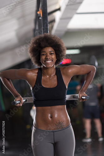 black woman doing parallel bars Exercise