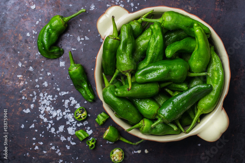 Tableau sur toile Raw green hot mexican peppers jalapeno pimientos padron spanish tapas