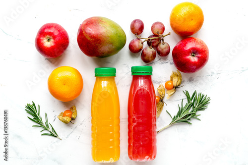 multifruit juice in plastic bottle on white background top view