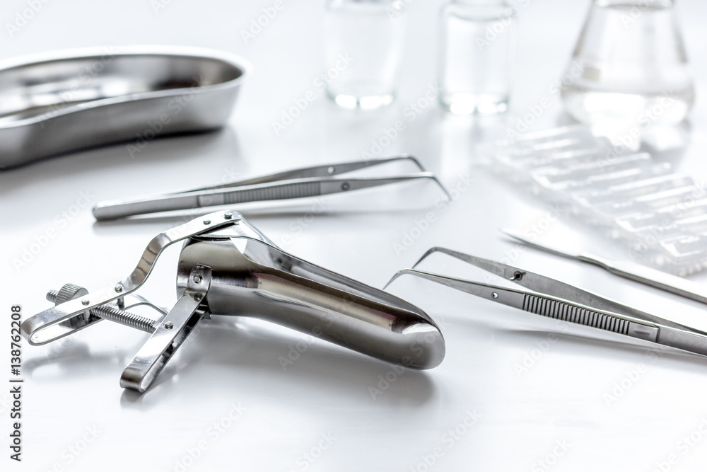 instruments of gynecologist on white background instruments of gynecologist on white background