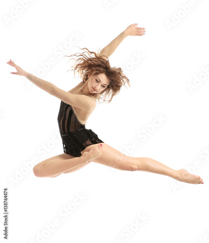 Beautiful young dancer on white background