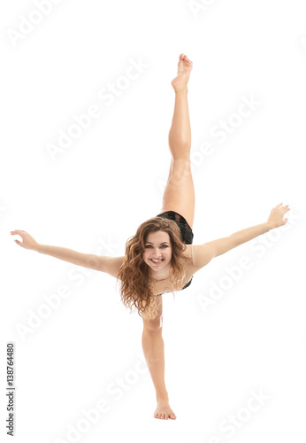 Beautiful young dancer on white background