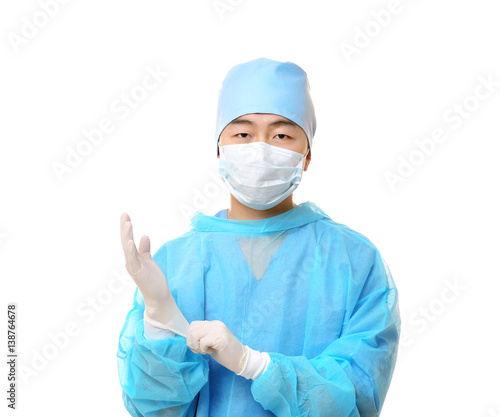Young Asian doctor on white background