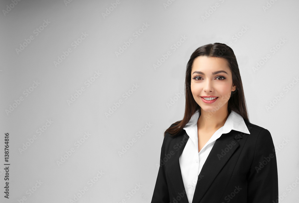 Beautiful young teacher on light background Beautiful young teacher on light background
