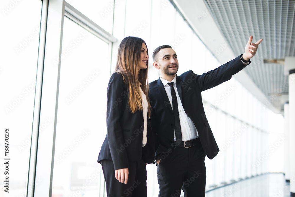 A businessman showing a plan to his colleague in office A businessman showing a plan to his colleague in office