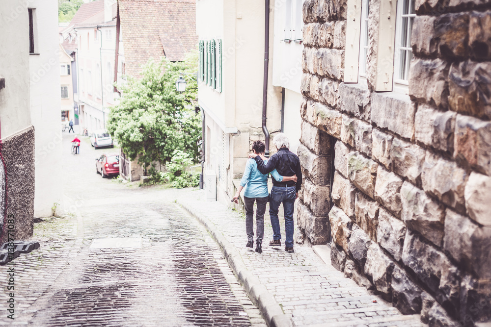 Senior Couple Walking Through The Streets Of Tuebingen,