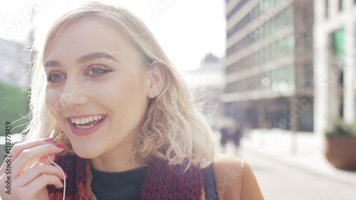 Wallpaper Mural Attractive young woman on an escalator checking her phone, with space for text Torontodigital.ca