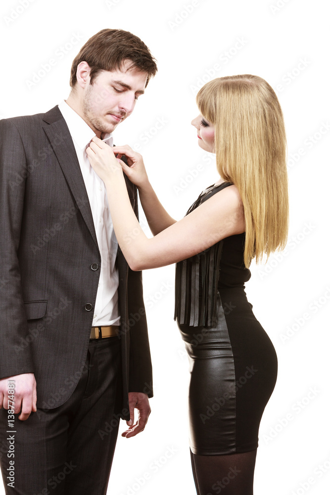 Woman helping man dress up elegant clothes. Woman helping man dress up elegant clothes.
